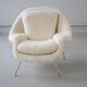 Womb Chair and Ottoman in fluffy white fabric by Eero Saarinen