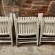 Five wooden garden armchairs