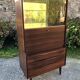 Vintage Scandinavian secretary in rosewood with drawers featuring fin-style handles.