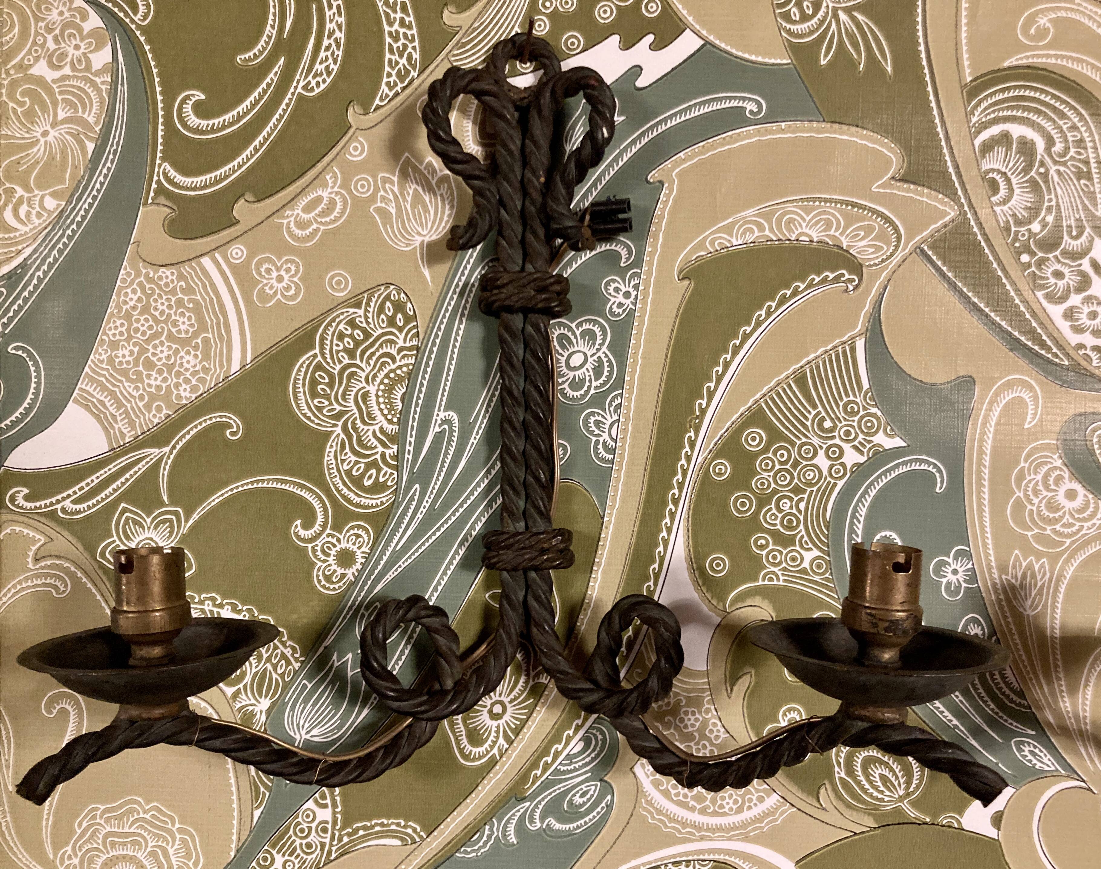 Pair of corded wrought iron wall lights