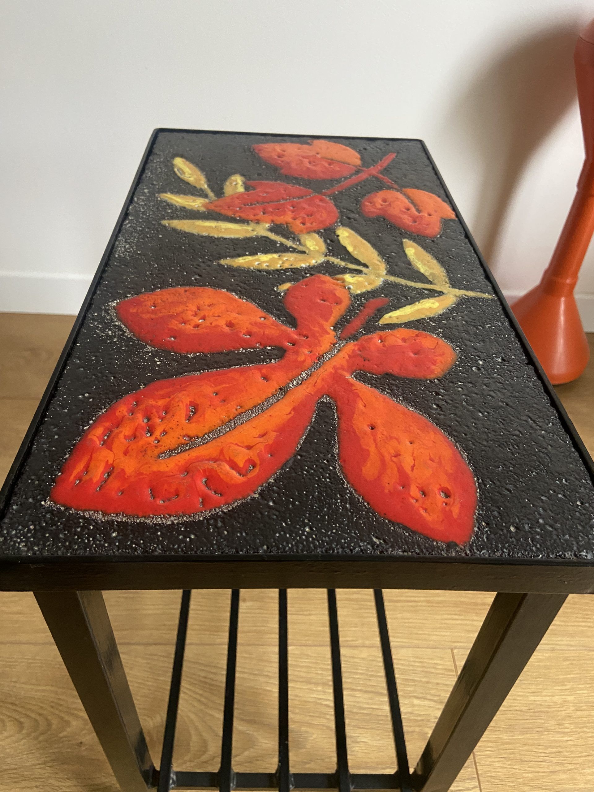 Side table or end of sofa in wrought iron and enamelled lava stone circa 1960