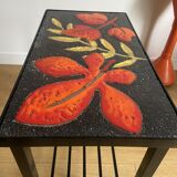 Side table or end of sofa in wrought iron and enamelled lava stone circa 1960