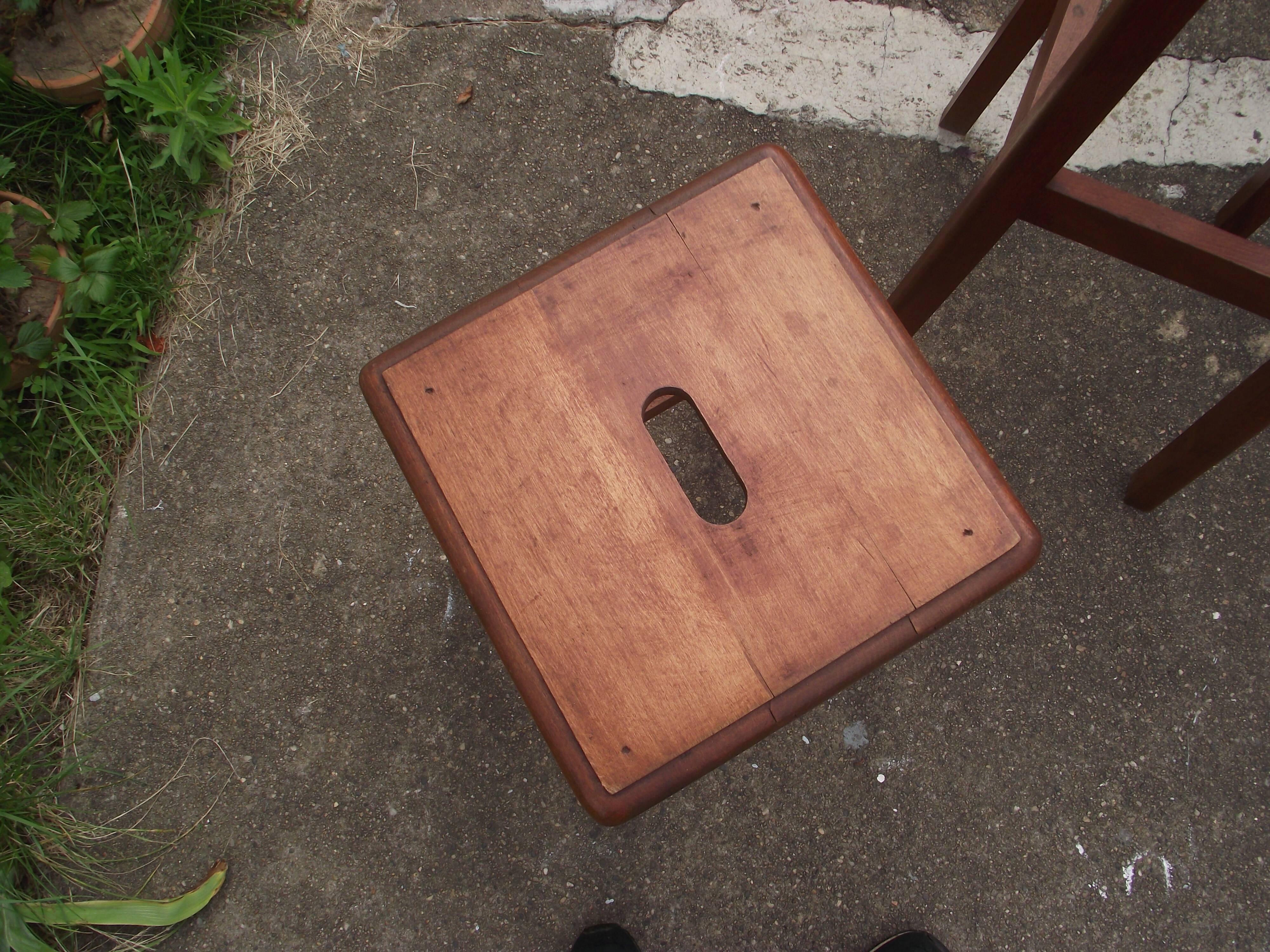 Two wooden artist stools in the early 20th century