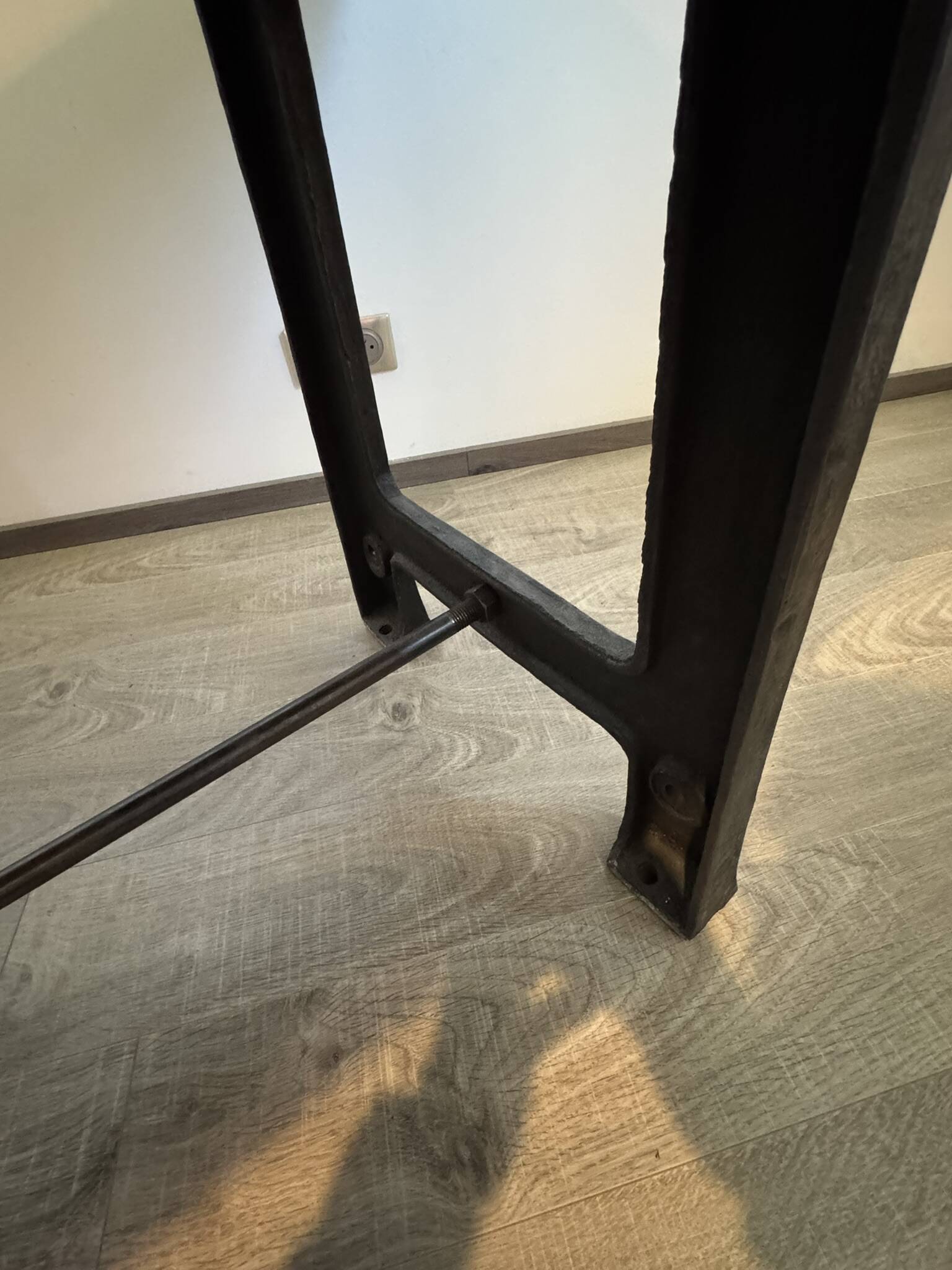 Industrial style table with a mahogany top.