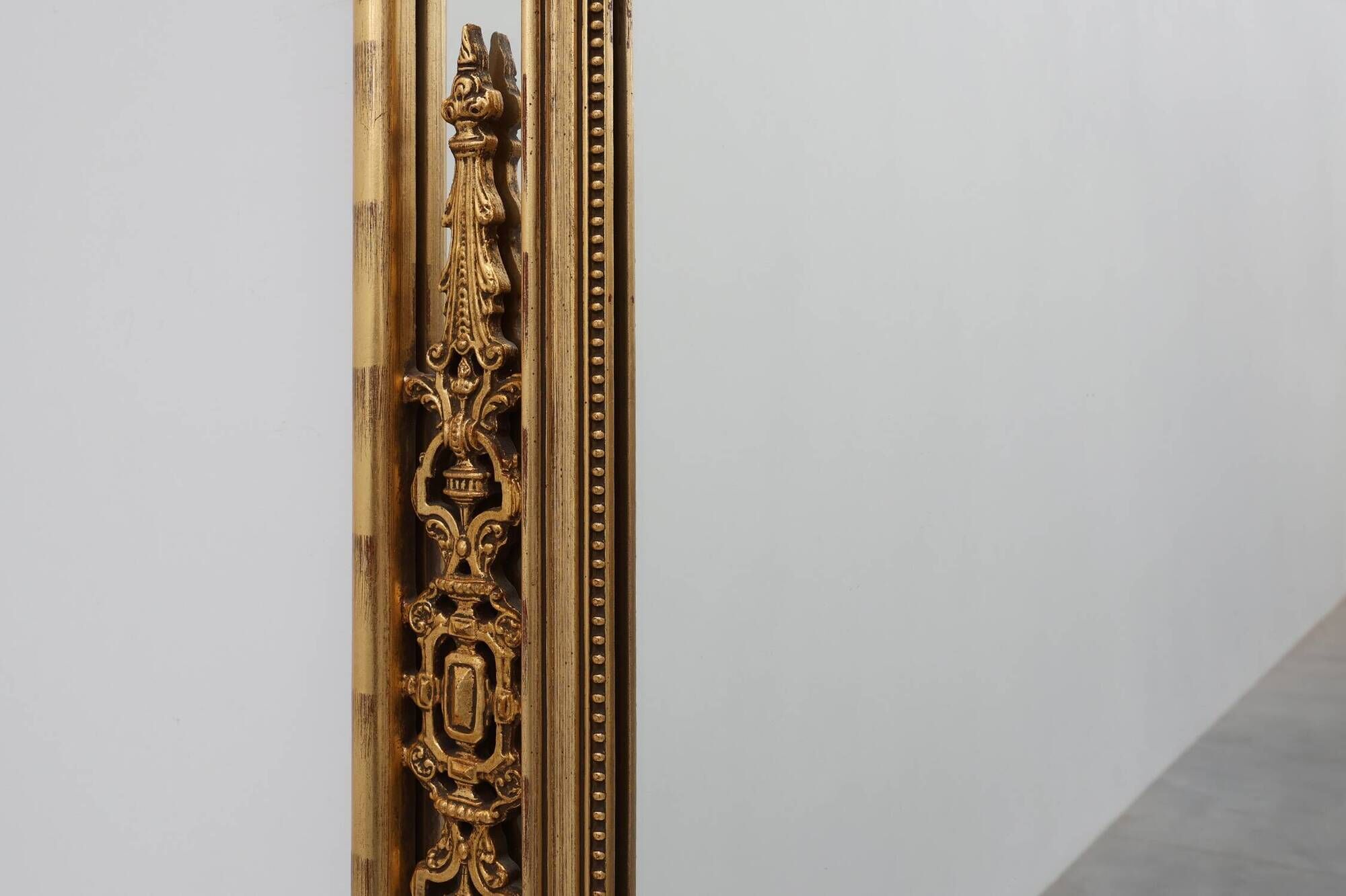 Louis XVI style gilt mirror with laurel wreath crest, Belgium, 20th century