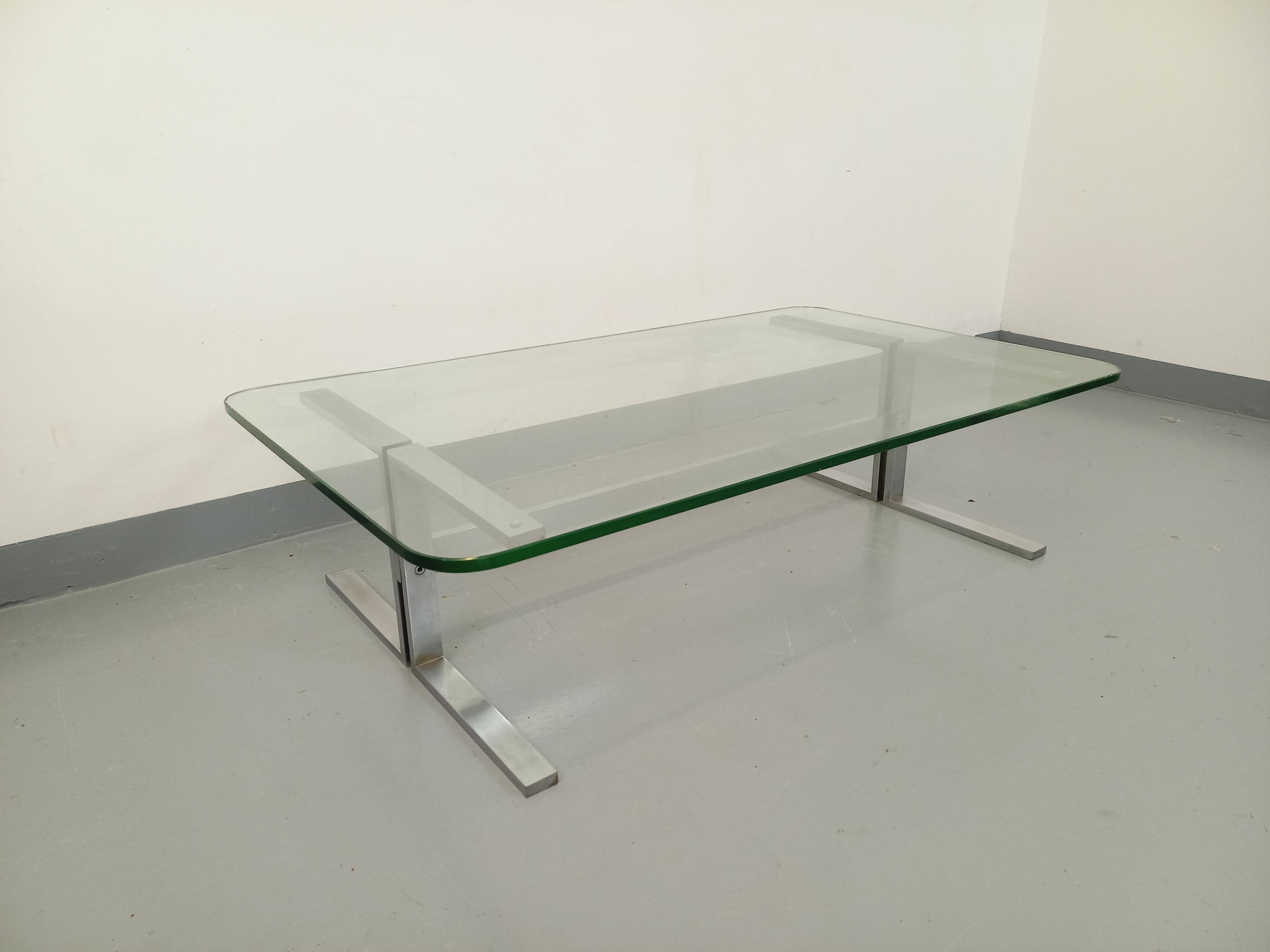 Vintage coffee table in transparent glass and cast aluminum from the 70s