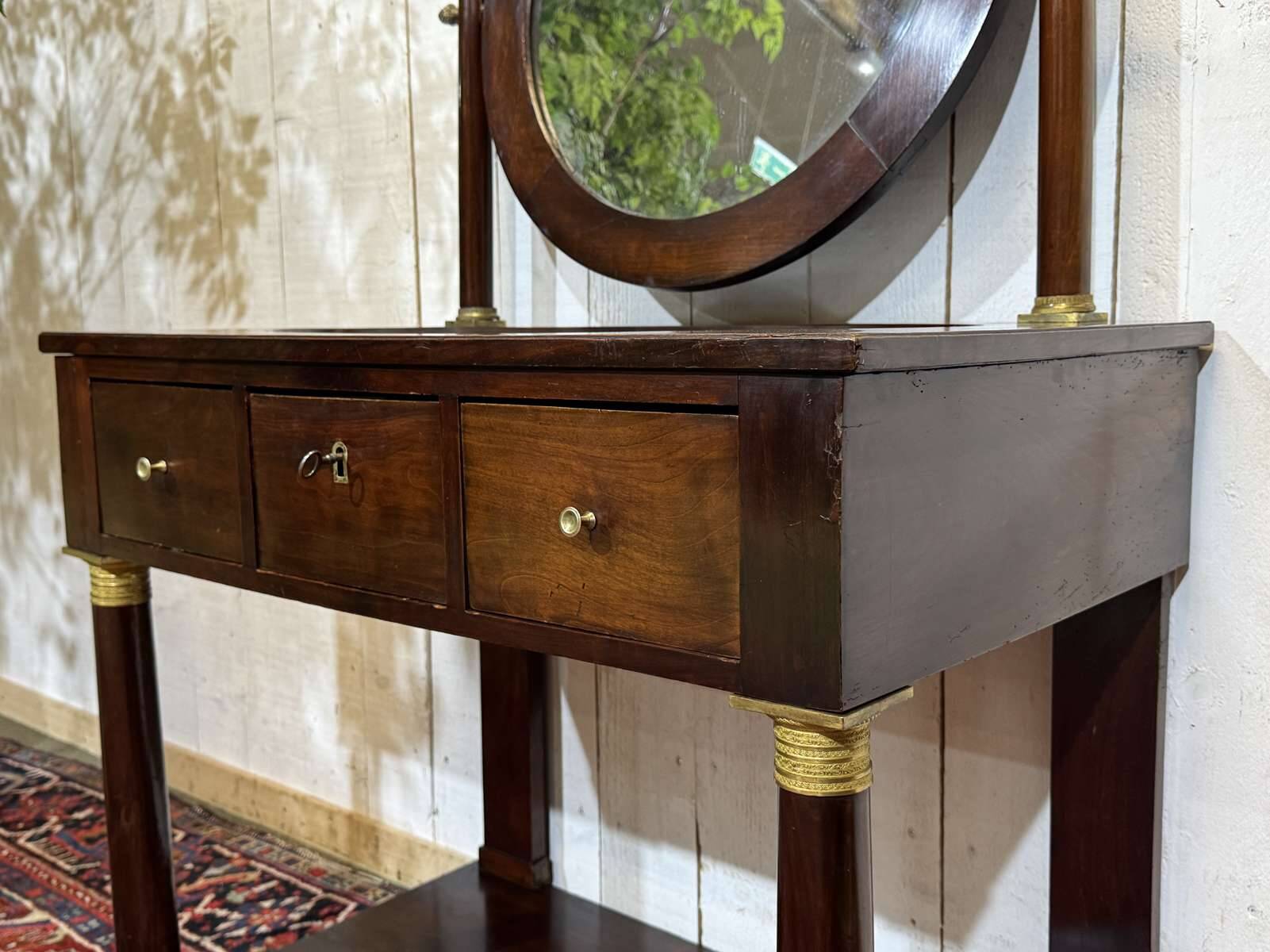 Empire hairdresser from the 19th century in mahogany with a marble top.