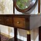 Empire hairdresser from the 19th century in mahogany with a marble top.
