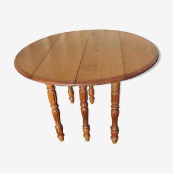 Former round oak table at six feet with two extensions in oak