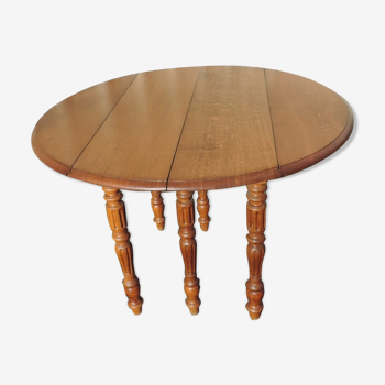 Table ronde en chêne ancienne à six pieds avec deux allonges en chêne