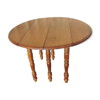 Former round oak table at six feet with two extensions in oak