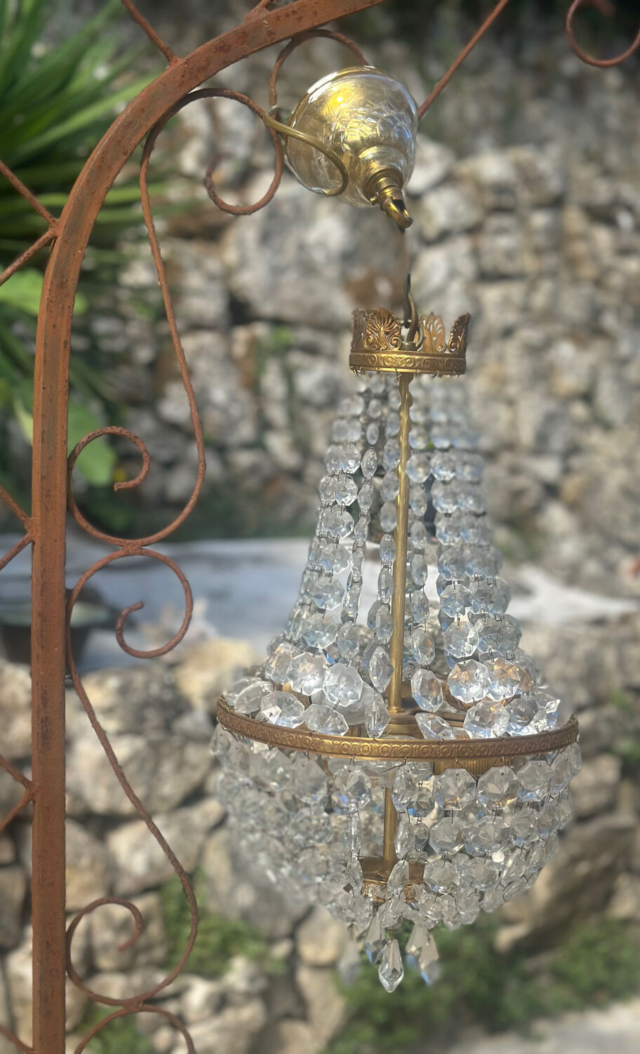 Basket chandelier with crystal and gilded brass pendants, circa 1930.