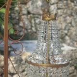 Basket chandelier with crystal and gilded brass pendants, circa 1930.