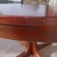 round/oval table with extension, central leg, dark shade, Baumann design