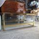 Vintage display coffee table in gilded brass and glass with a lock.