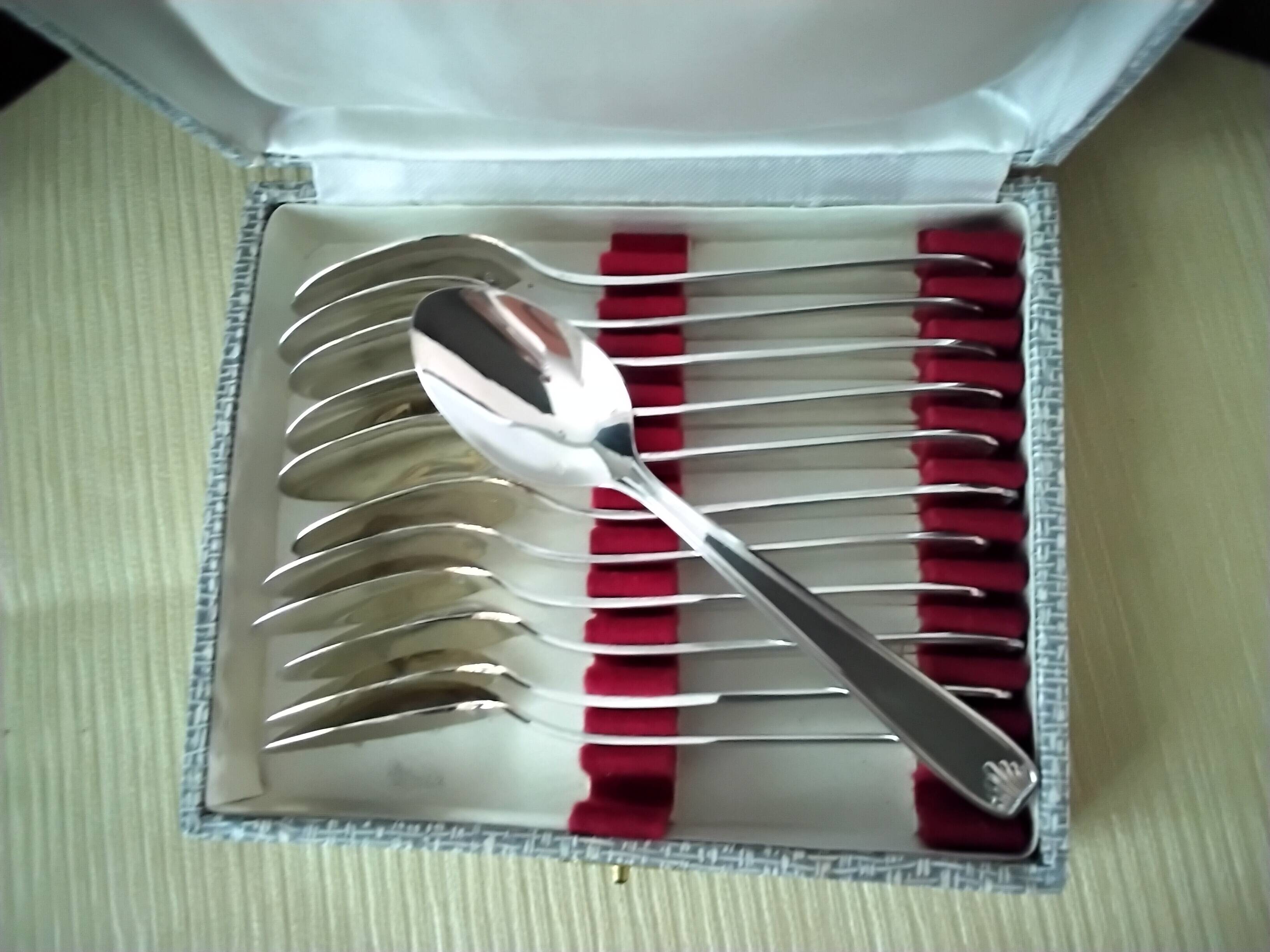 Set of 12 silver-plated coffee spoons in "shell" design.