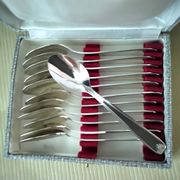 Set of 12 silver-plated coffee spoons in "shell" design.