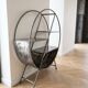 Round shelf on a stand in industrial style made of steel.
