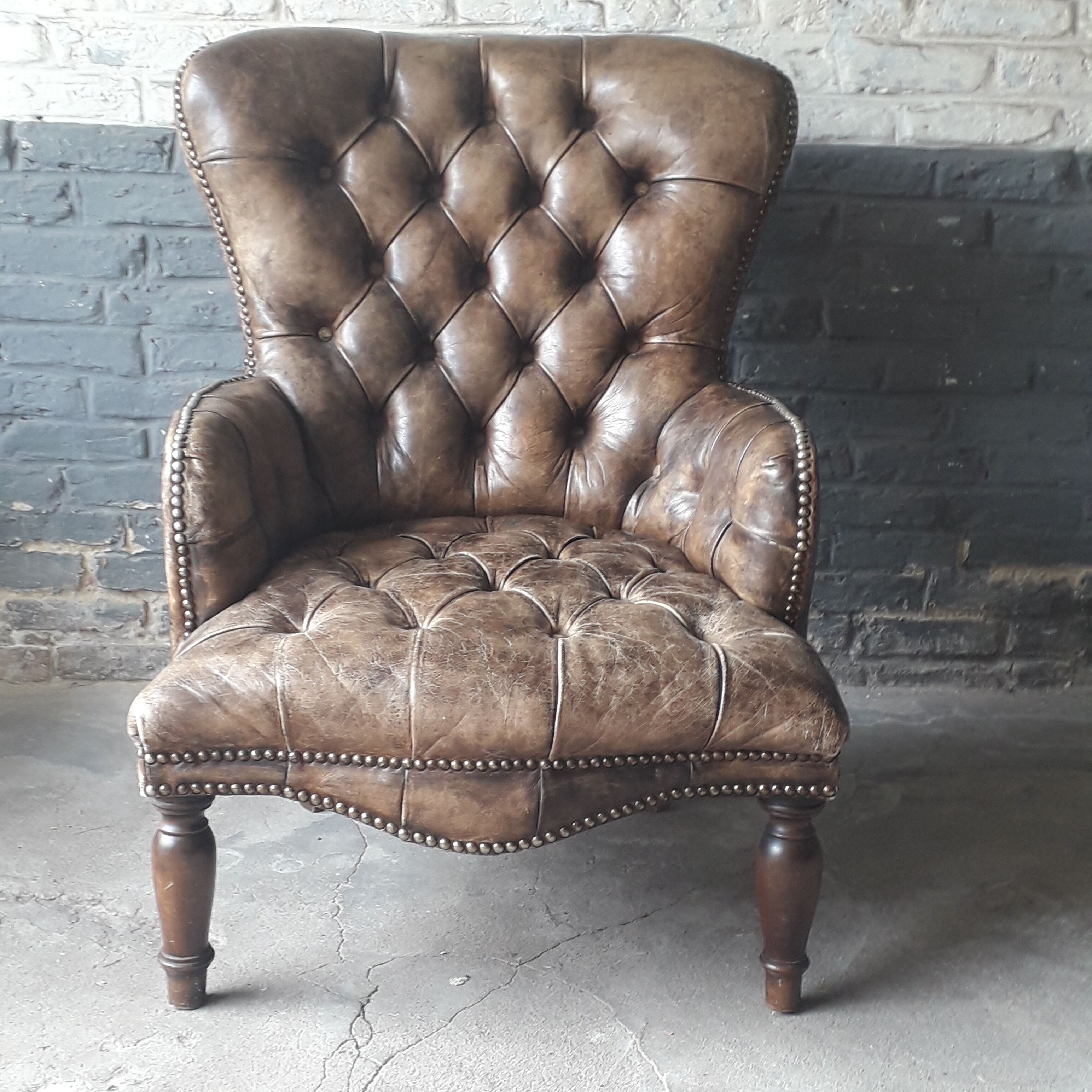 Fauteuil Chesterfield antique