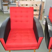 Pair of vintage red fabric armchairs with light wood legs from the 1960s.
