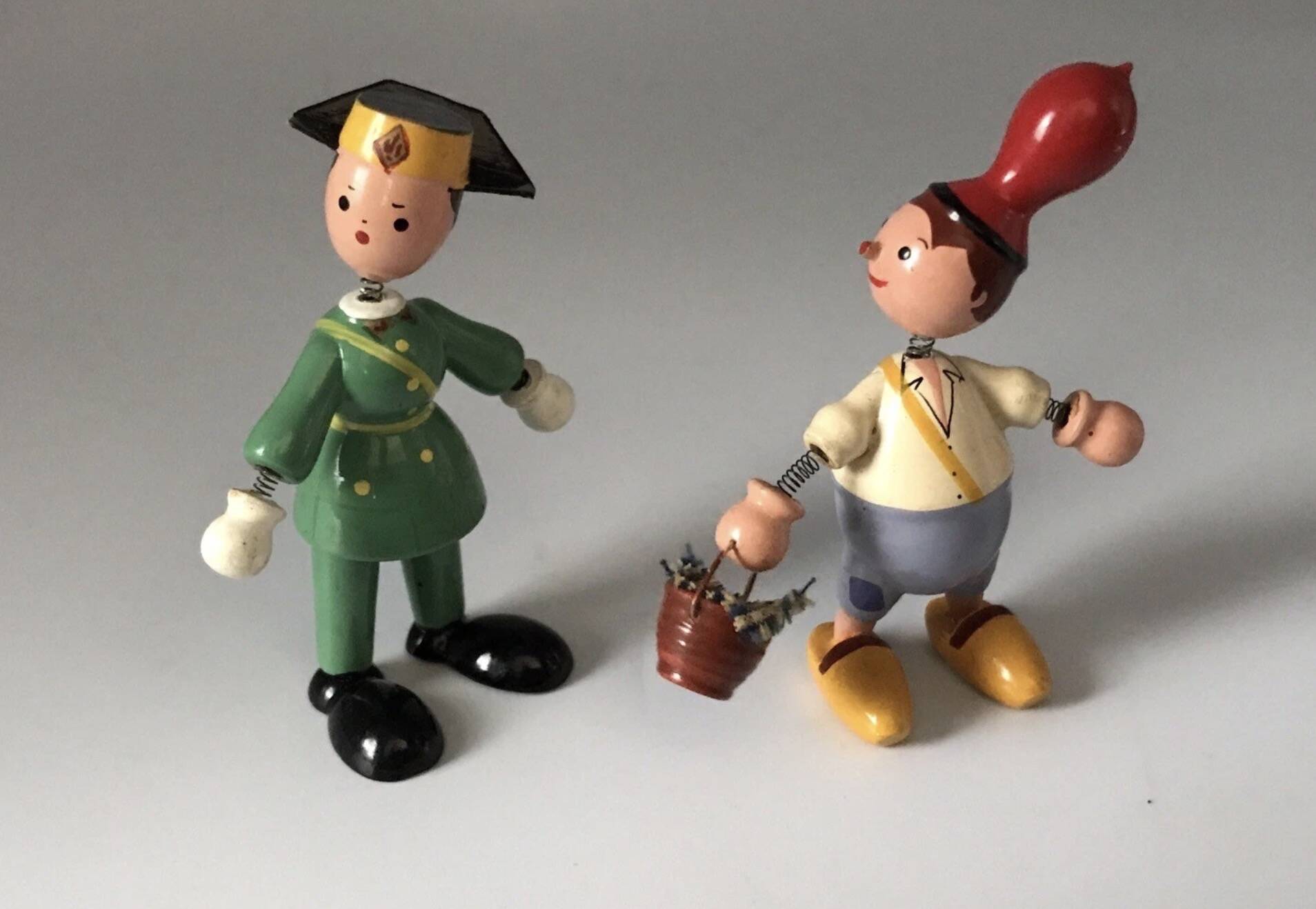 Set of 2 vintage GOULA wooden toy figurines with spring.