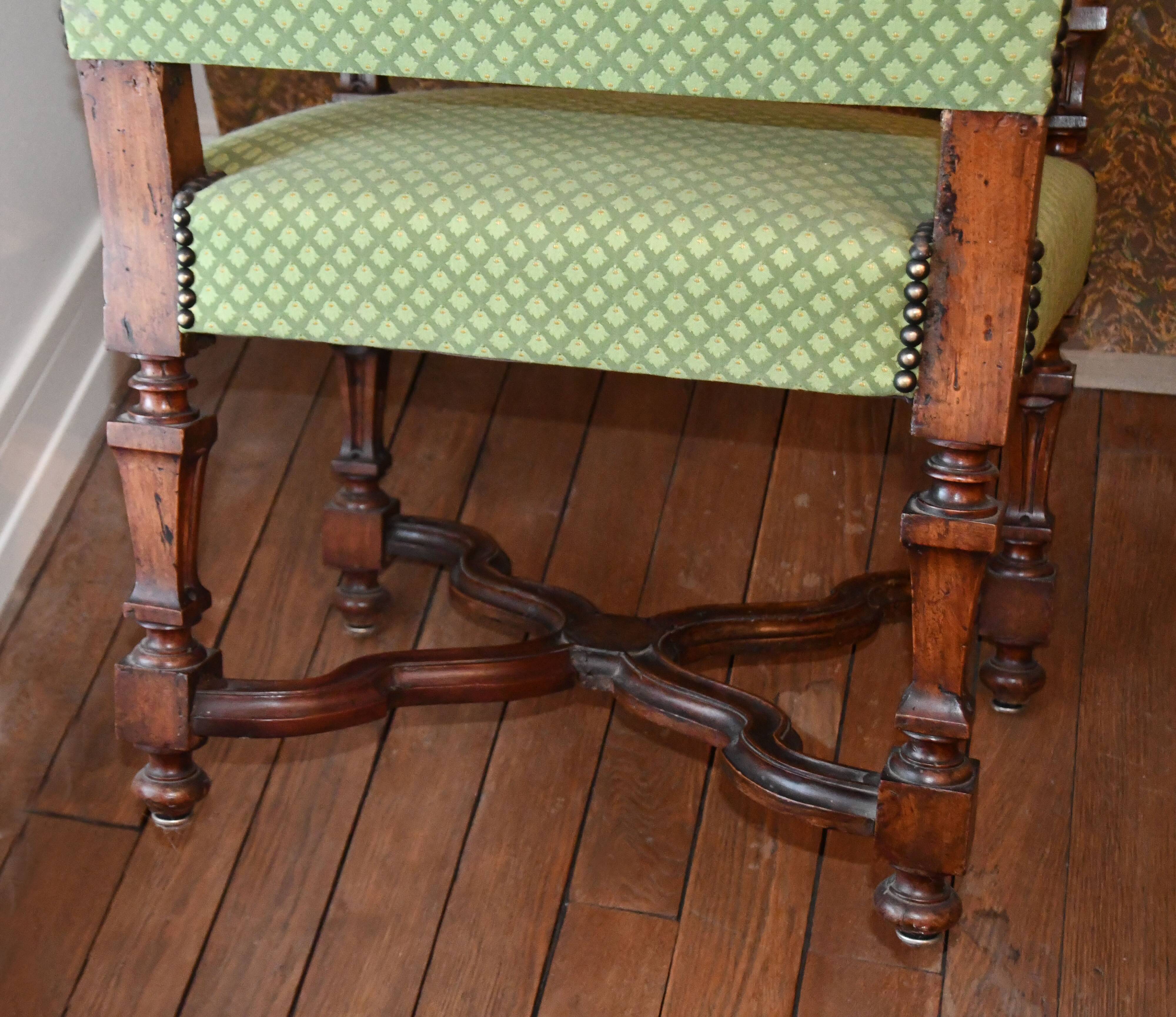 Pair of 17th century ecclesiastical armchairs, Italy, in walnut