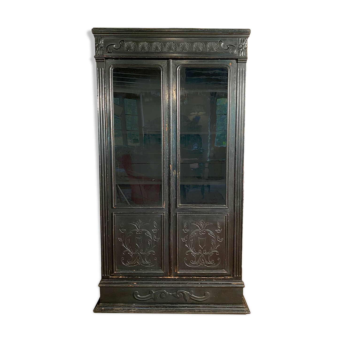 Blackened wooden display cabinet from the late 19th or early 20th century.