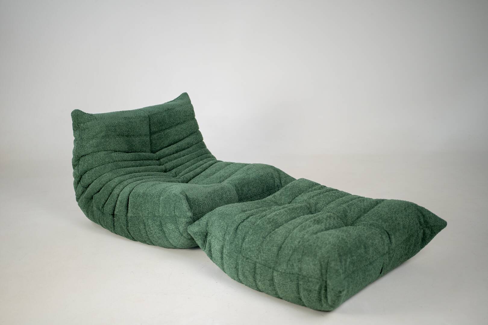 Togo set of armchair and pouf in emerald bucle