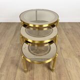 Vintage round nesting tables in gilded bronze with smoked glass