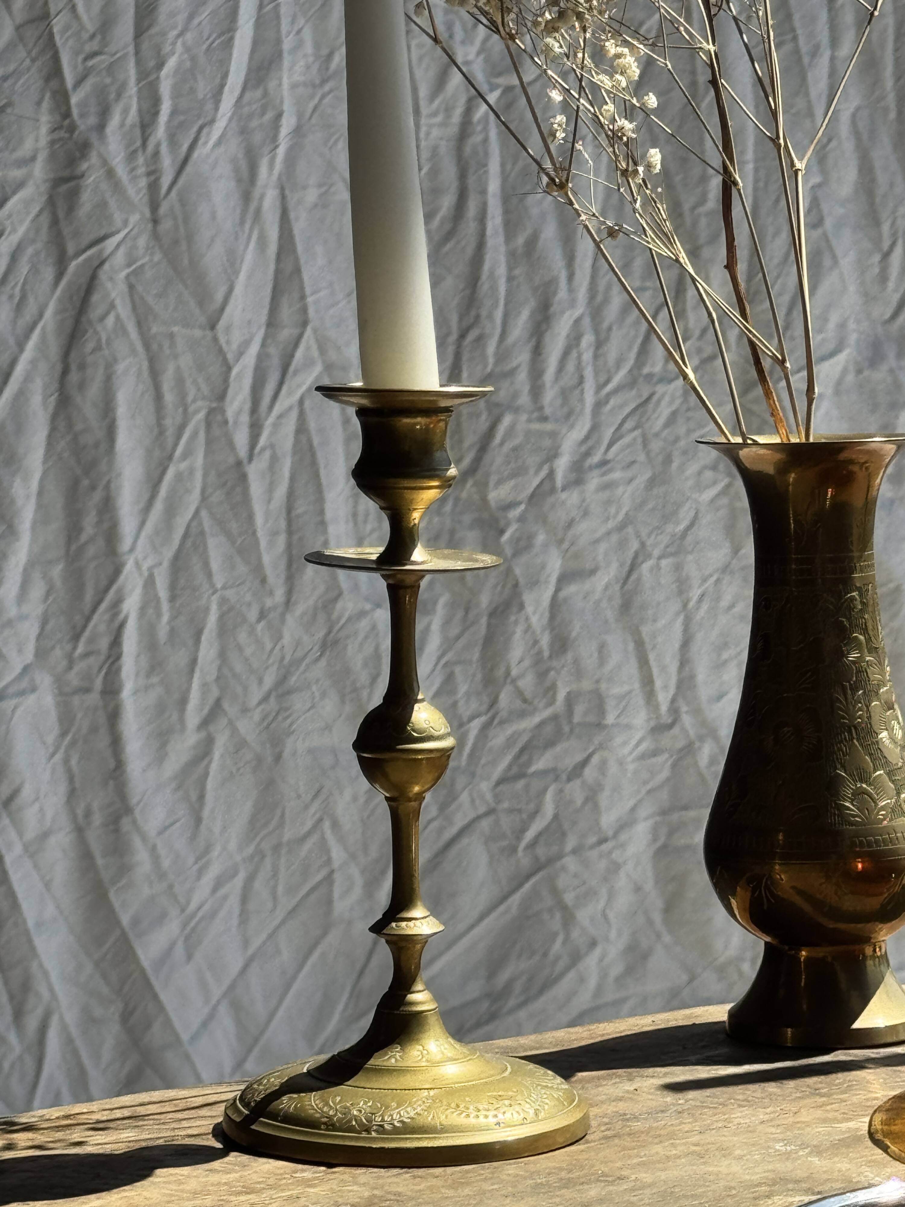 Pair of gilded candlesticks with engraved flower garland motifs H22