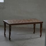 Vintage Indian teak coffee table inlaid with elephant motifs, mid-20th century.