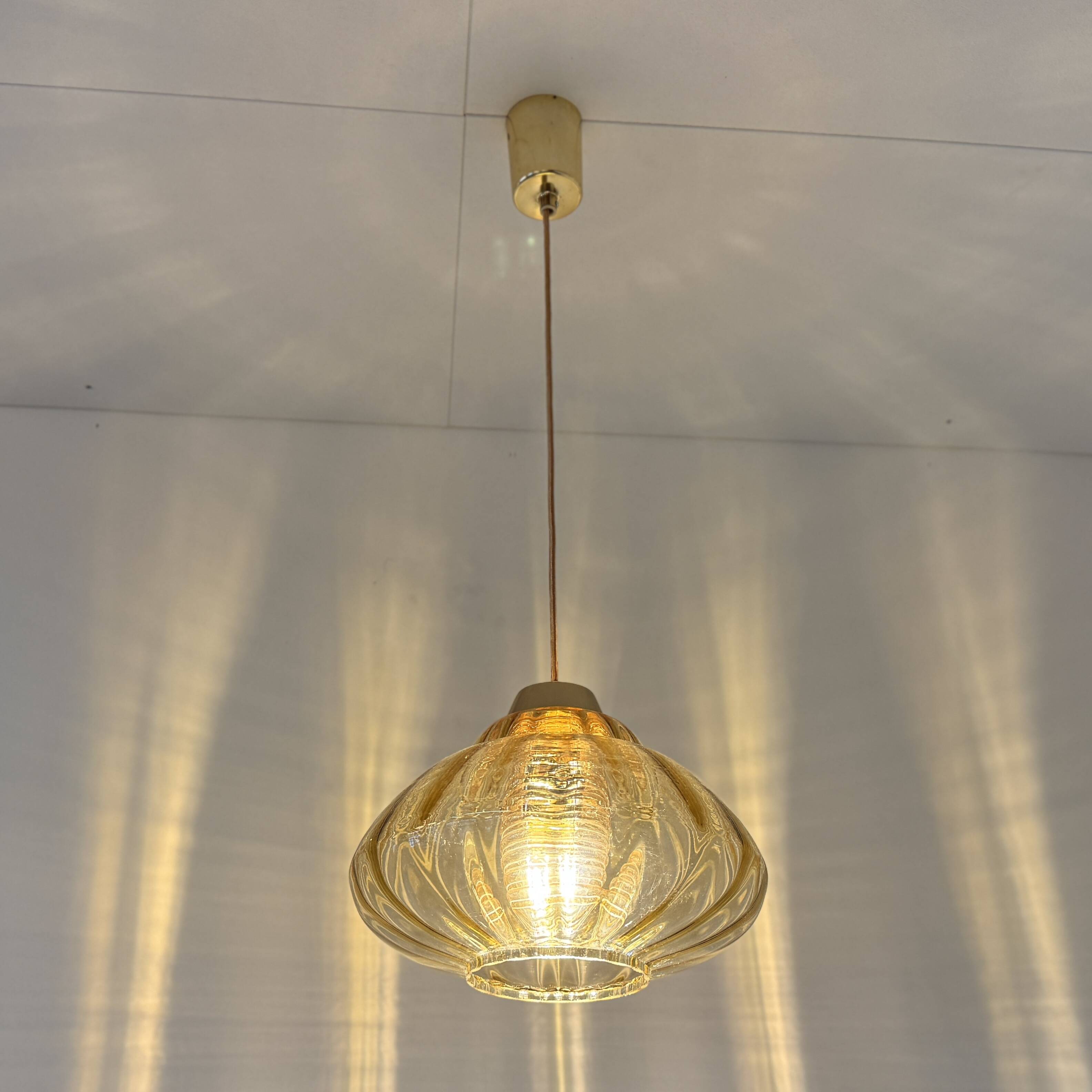 Vintage pendant lamp with amber glass shade
