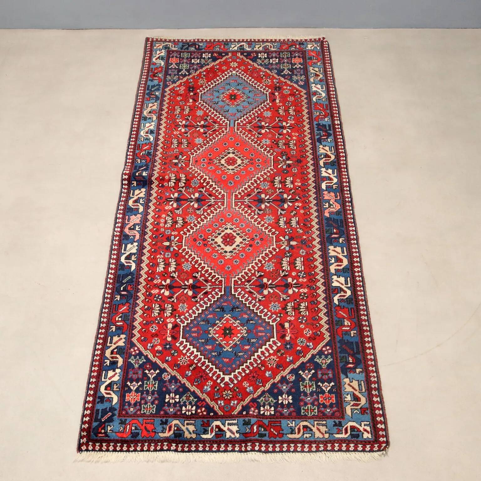 Ancient Asian wool rug, hand-knotted, 79 x 34 in.