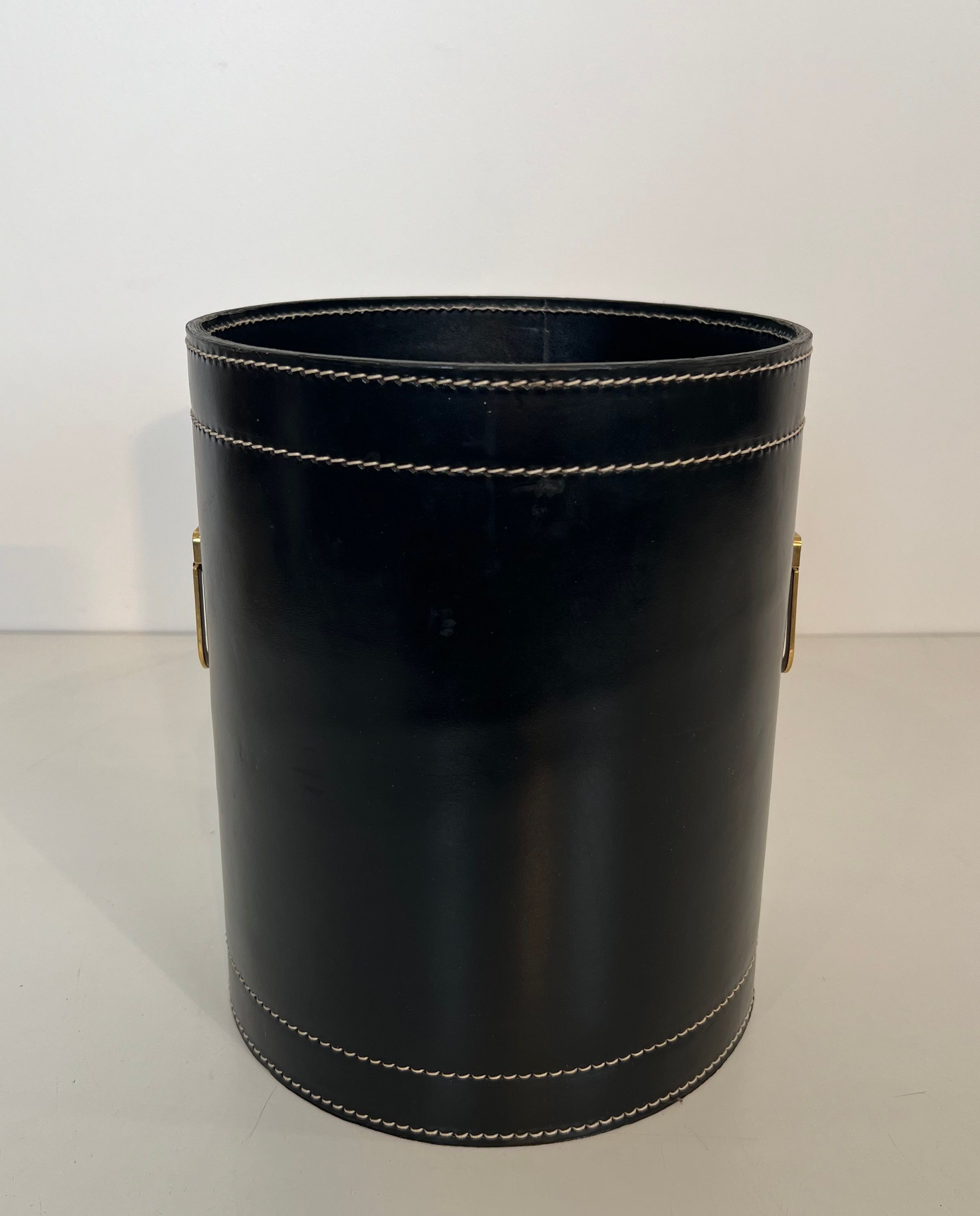 Black leather and brass desk basket