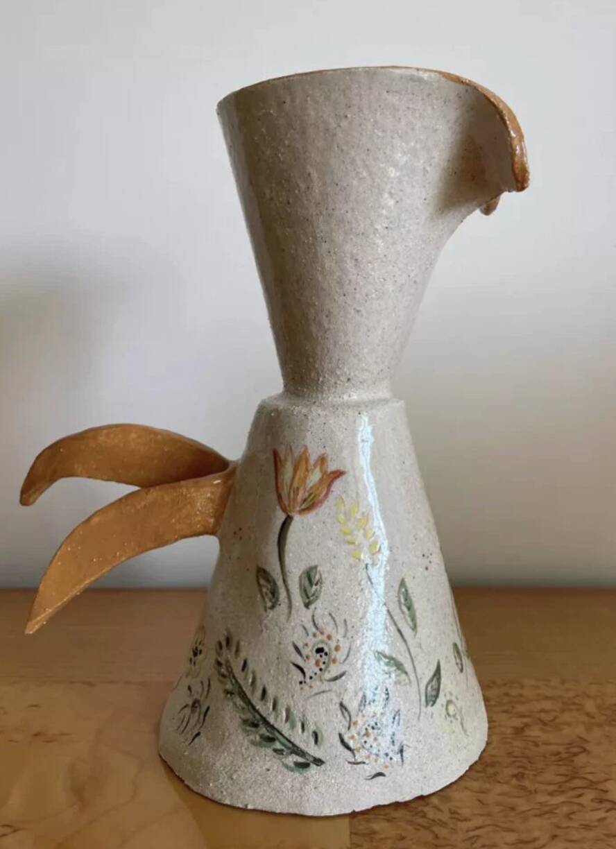 Handcrafted pitcher with floral motif