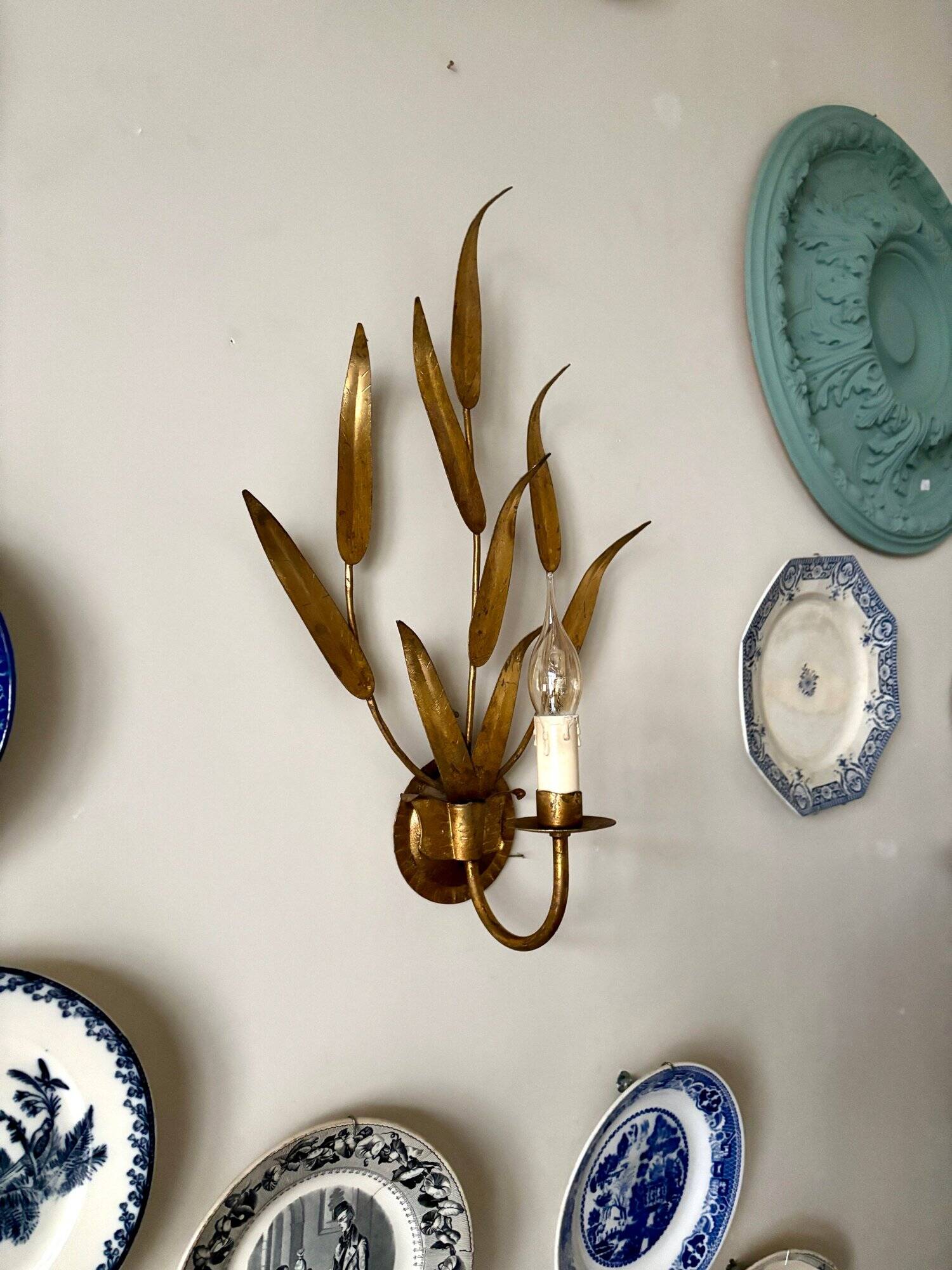 Gold metal leaf wall light