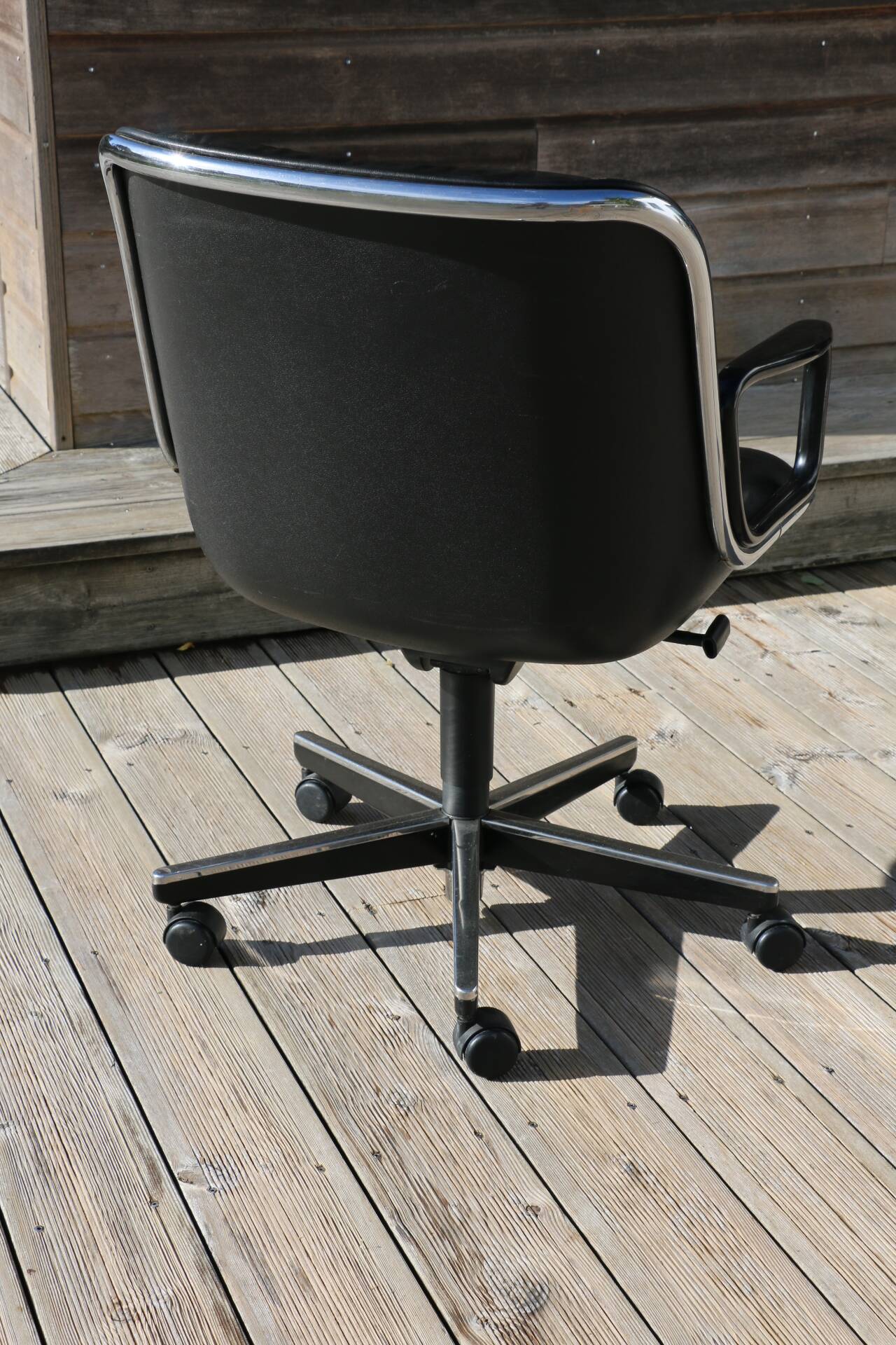 POLLOCK black leather reclining armchair with casters