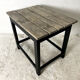 Old blackened wood work table and varnished top