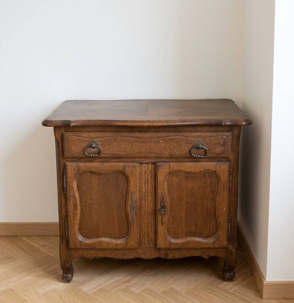 Rustic low cabinet in wood with herringbone marquetry.