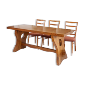 Solid wood dining table, sculpted brutalist base, 1960s.