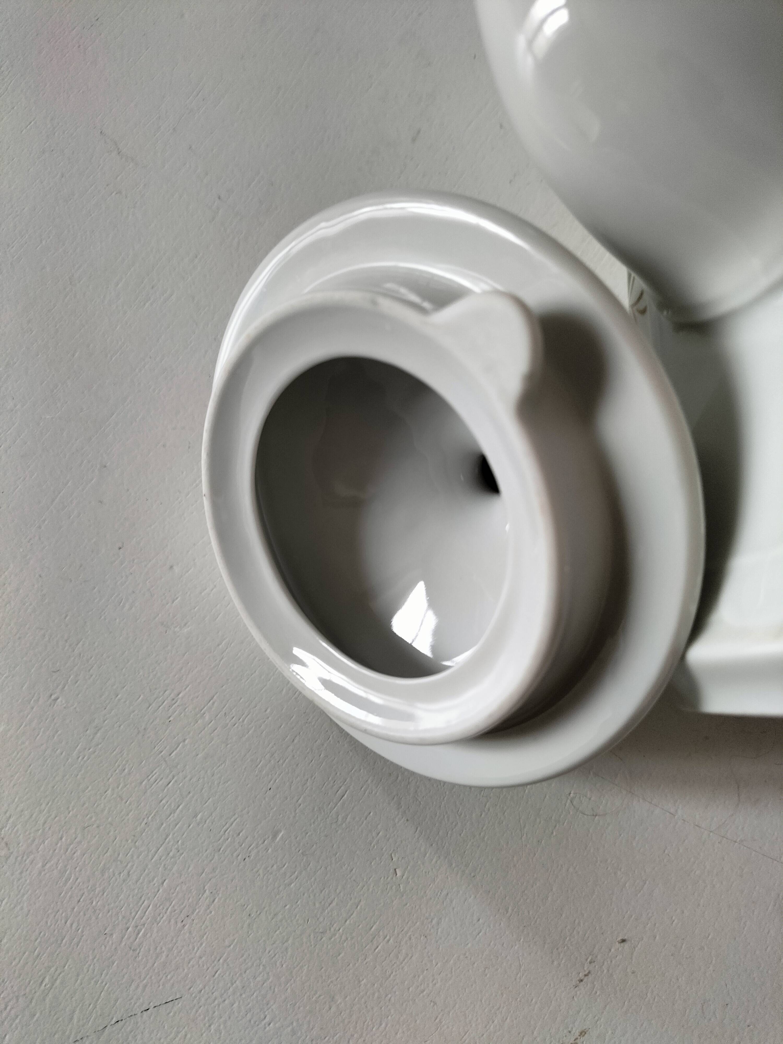 Vintage coffee pot Winterling Bavaria with orange floral decoration.