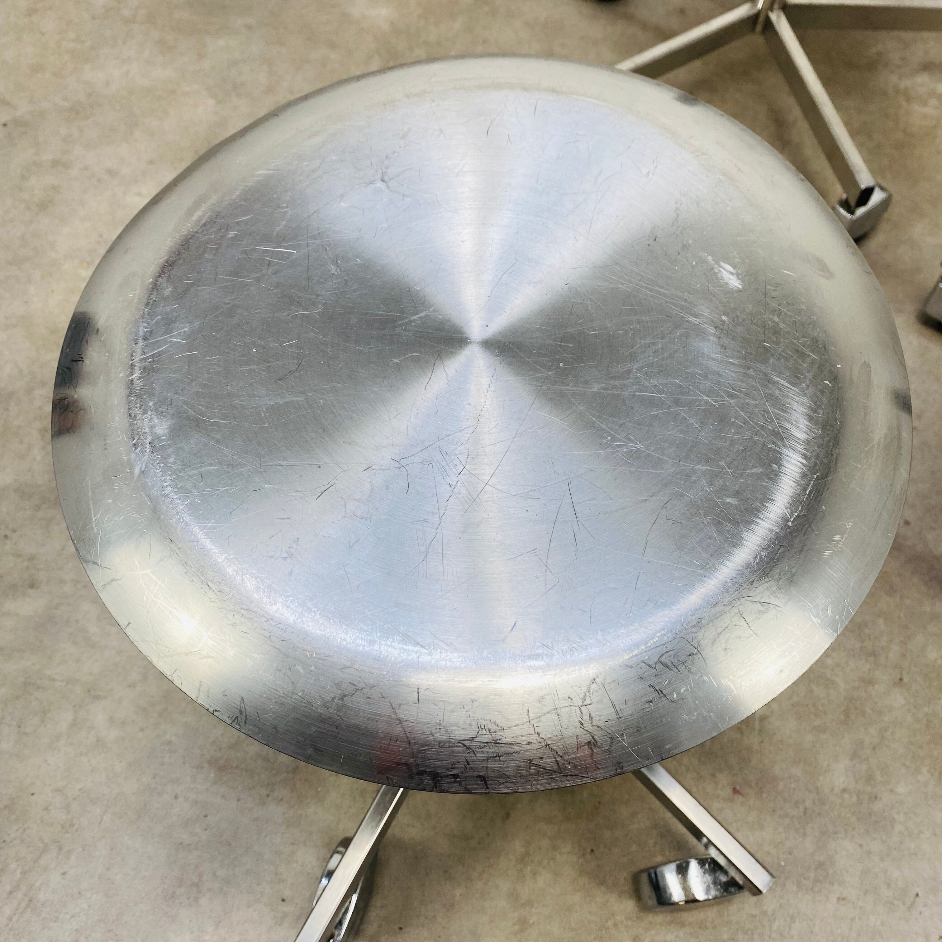 3 adjustable industrial stools with aluminum wheels