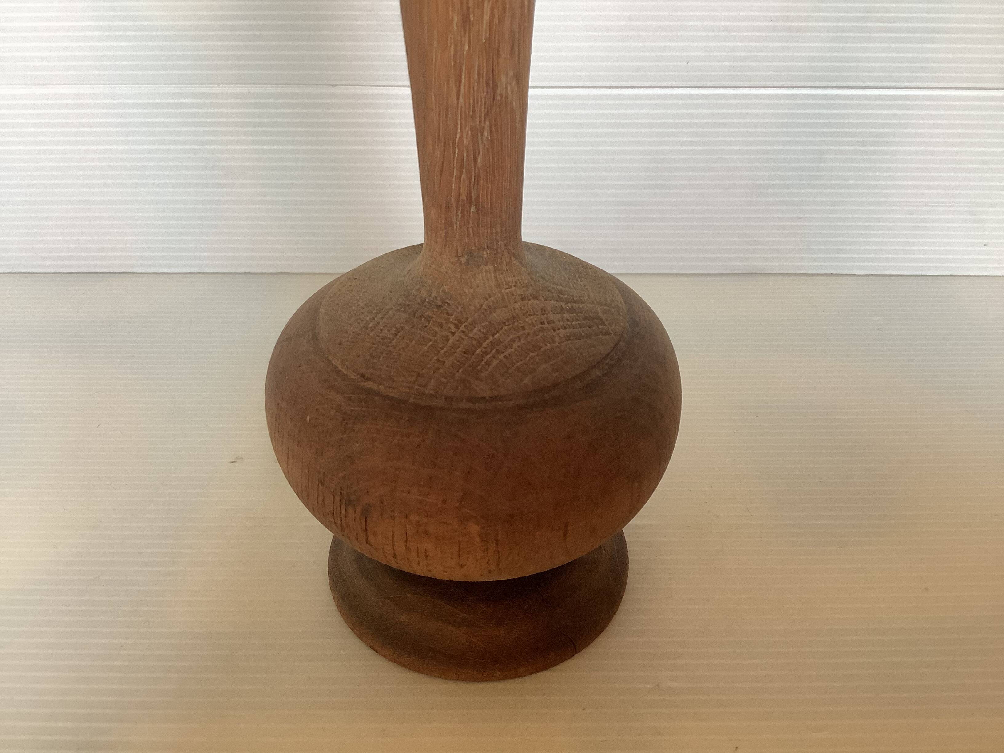 Old trumpet-shaped wooden vase