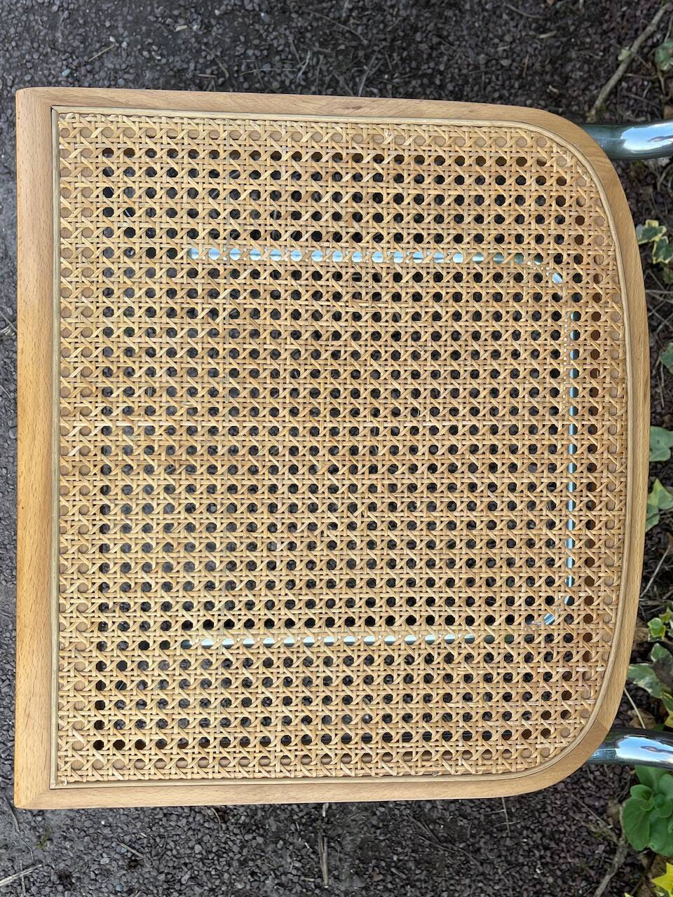 Wooden chair with caning in the style of Marcel Breuer.