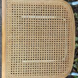 Wooden chair with caning in the style of Marcel Breuer.