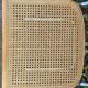 Wooden chair with caning in the style of Marcel Breuer.