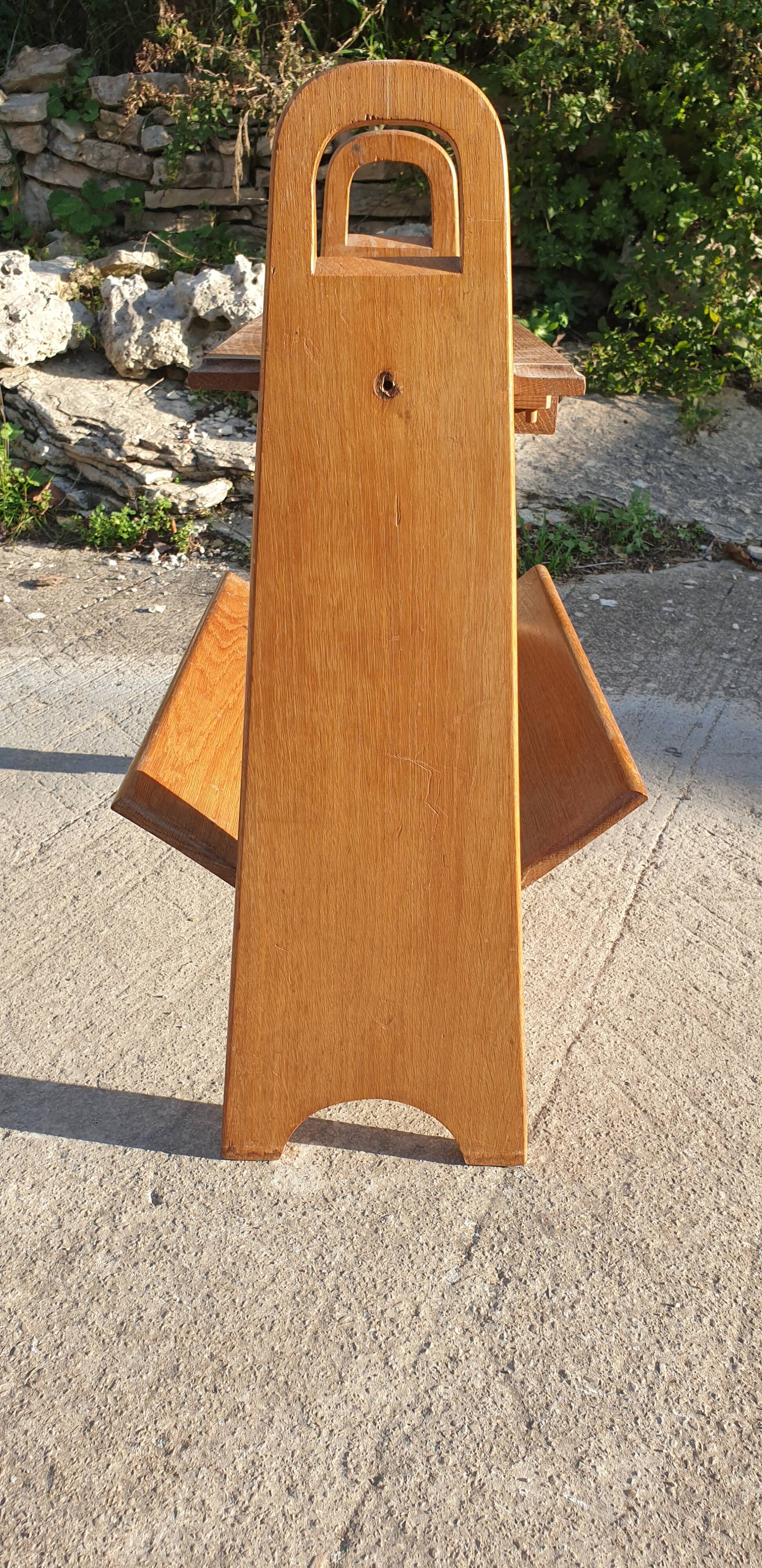 Magazine rack with sliding drawers in light wood, Scandinavian style.