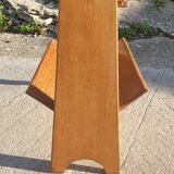 Magazine rack with sliding drawers in light wood, Scandinavian style.