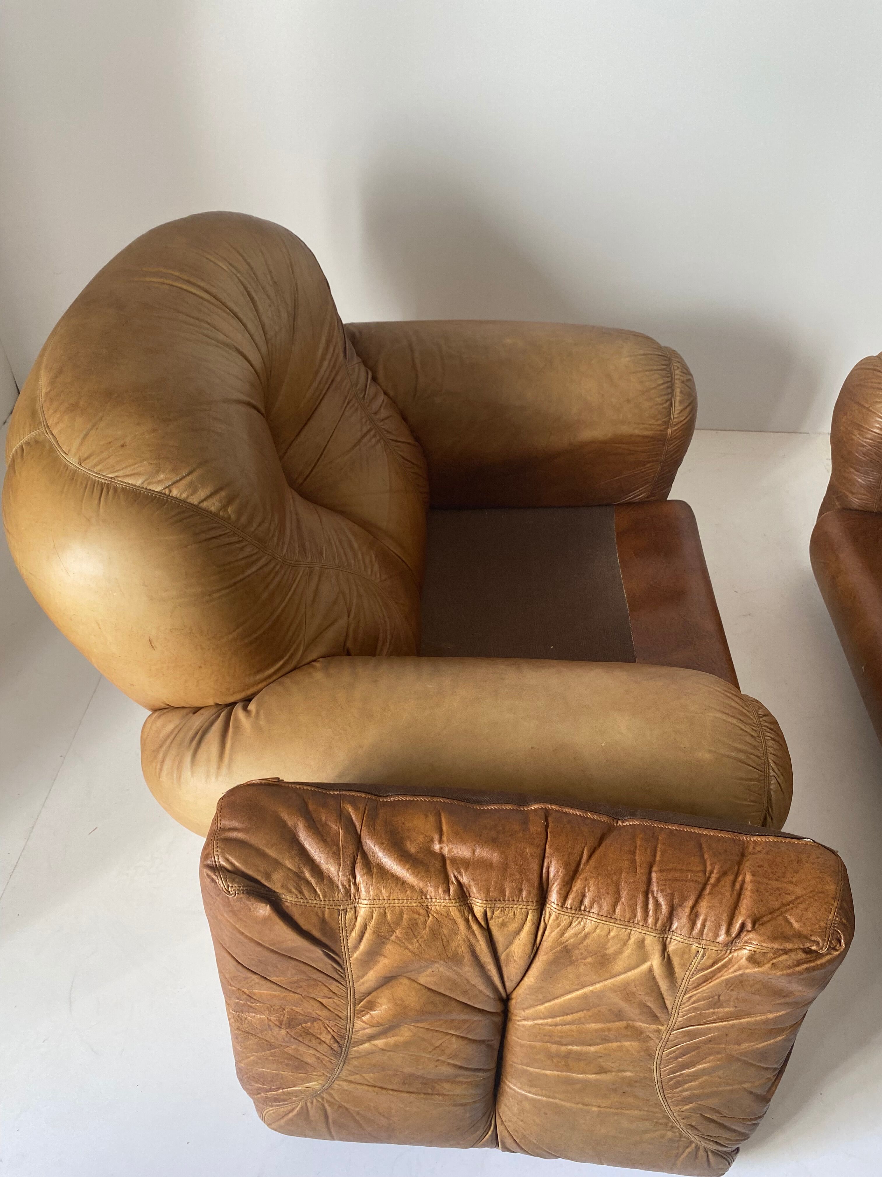Pair of brown leather armchairs