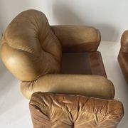 Pair of brown leather armchairs